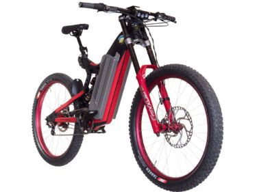 An optibike R22 everest long range 300 mile e-bike, hanging in front of a white studio background.